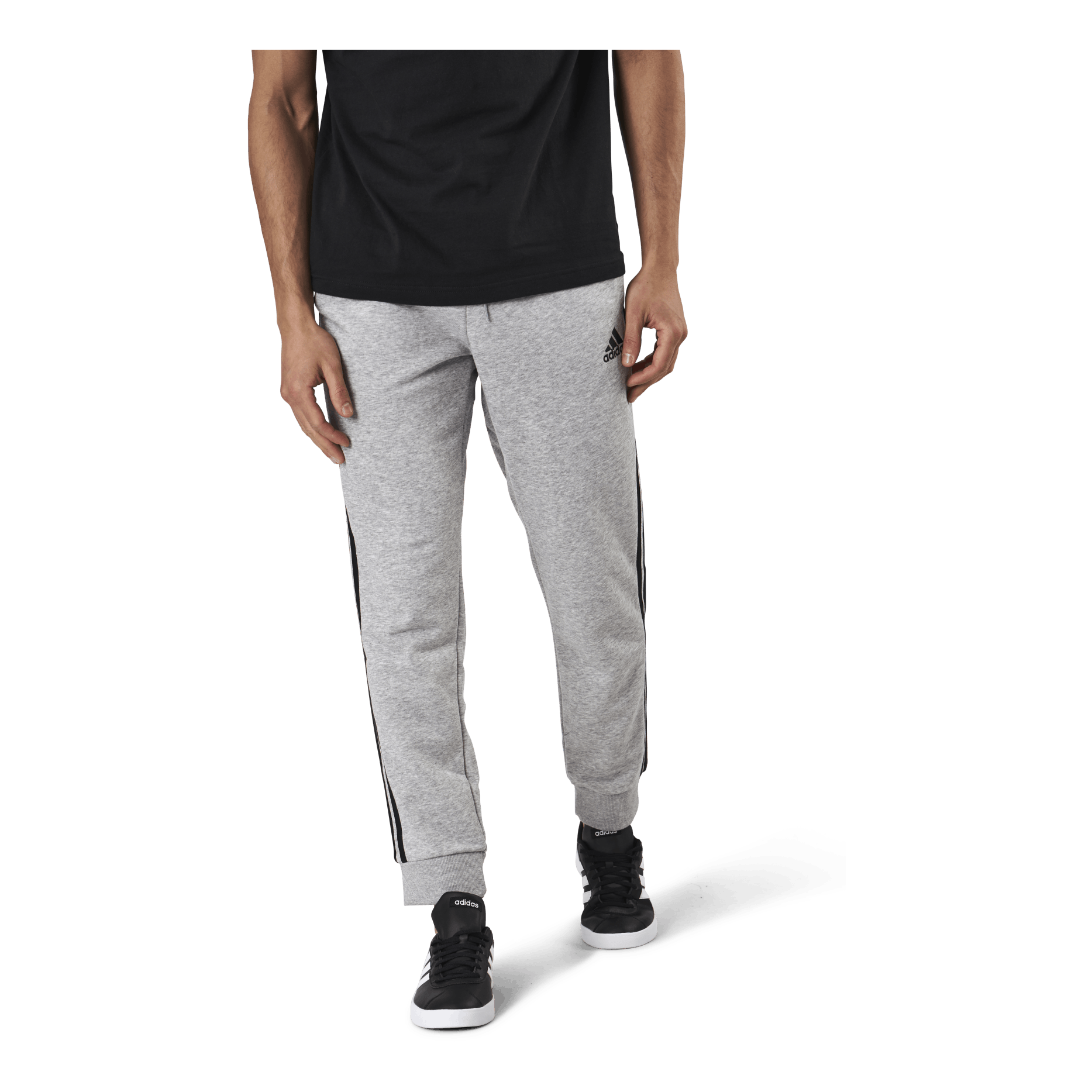 ADIDAS Essentials Tapered Cuff 3 Stripes Pants Medium Grey Heather / Black 1 ADIDAS Essentials Tapered Cuff 3 Stripes Pants Medium Grey Heather / Black